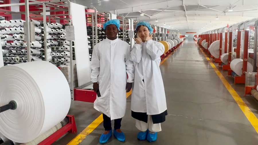 Our sales team guiding international customers through the PP woven bag and FIBC bag manufacturing facility.