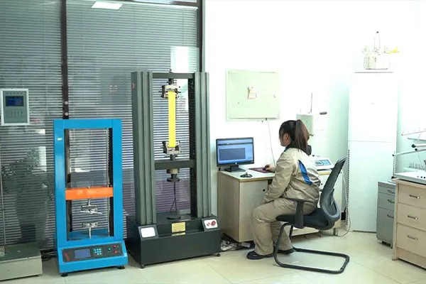 Quality inspector testing lifting loop tensile strength in the inspection lab