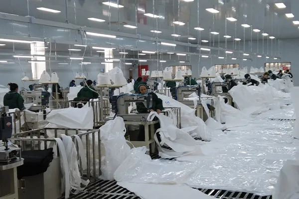 Food-grade FIBC bag sewing workshop with workers at sewing stations